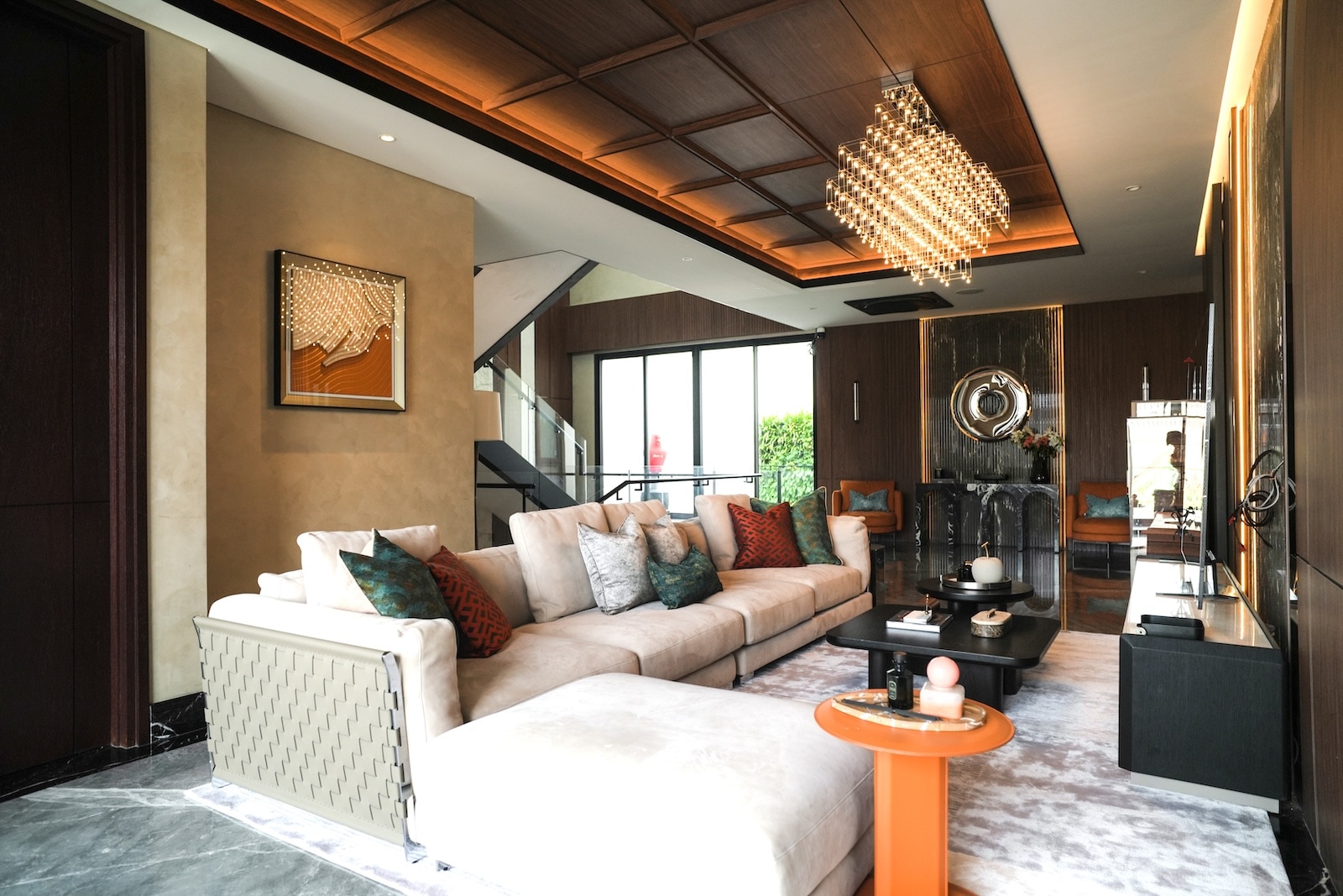 Grand living room with crystal chandelier and modular sectional