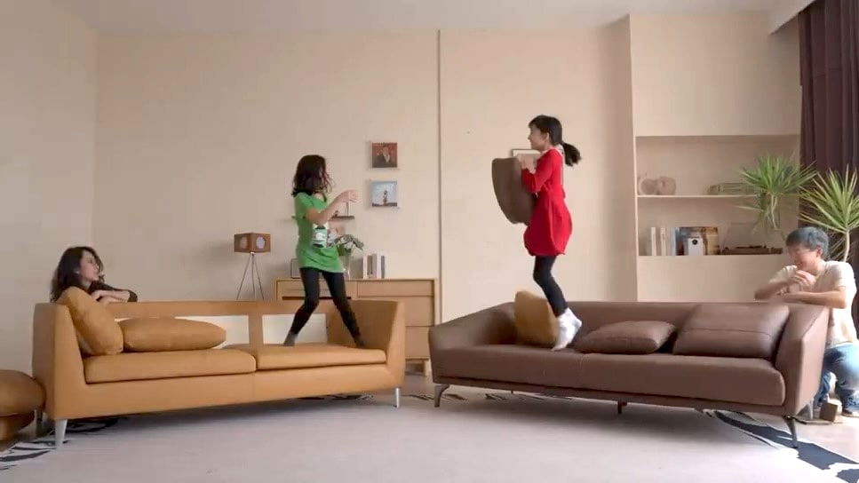 Family enjoying premium leather sofas in a furnished home
