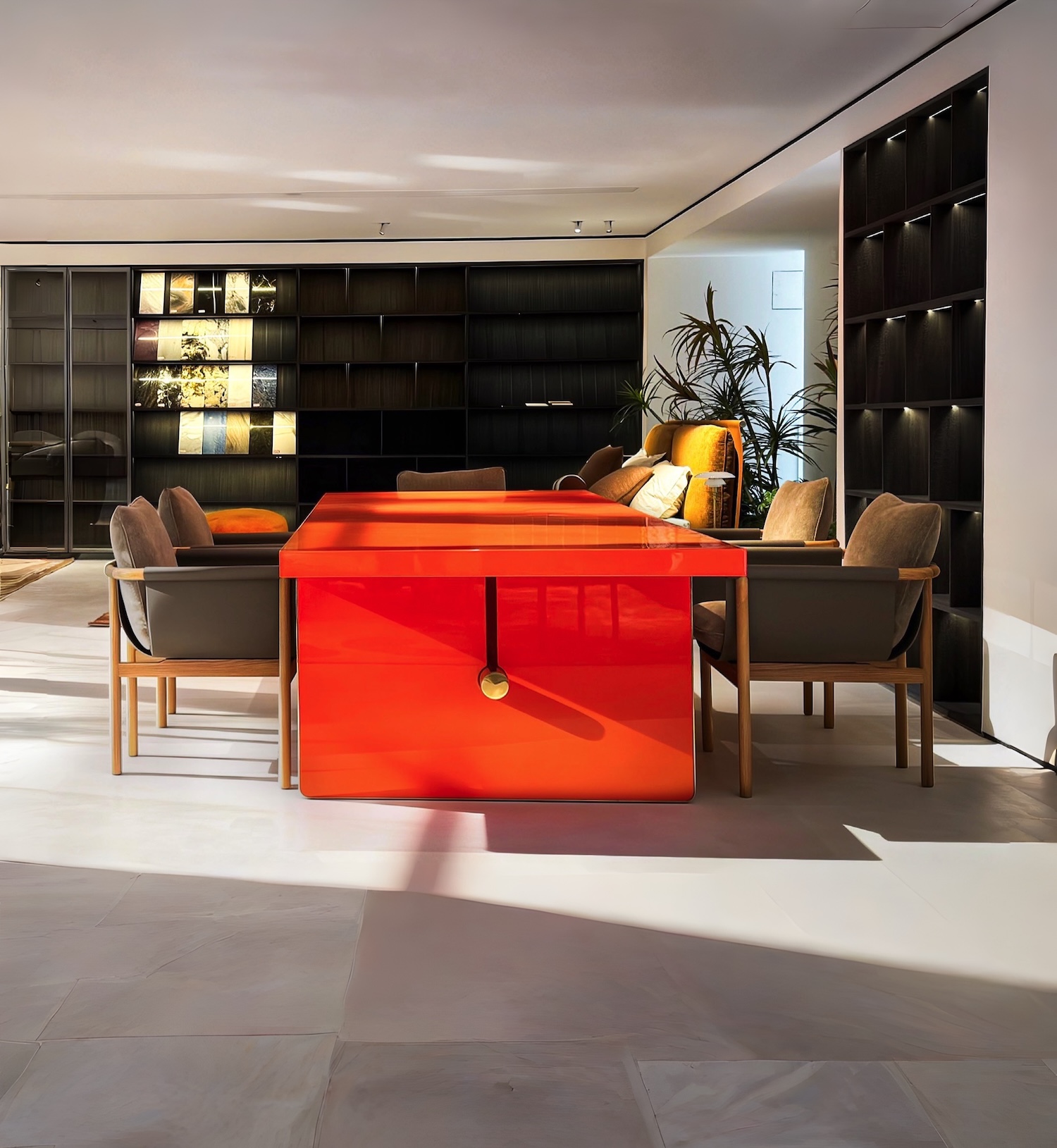 Modern dining collection with orange lacquer table in a partner factory showroom